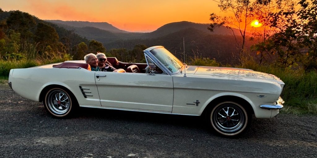 honeymooners in classic car on tamborine mountain